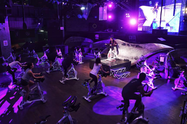  ​Spin classes have been growing in popularity in Singapore. When it was hit by coronavirus measures, Zouk nightclub introduced wildly popular spin classes on its dance floor. PHOTO ST FILE
